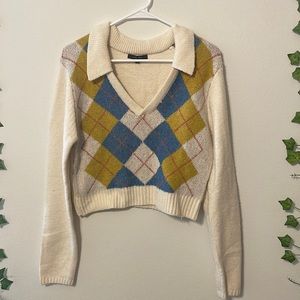 This is a size Large Love Tree collared cropped sweater.